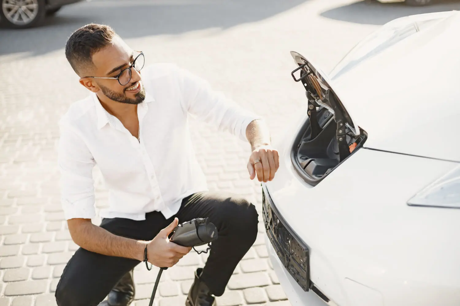 man in uae using ev charger